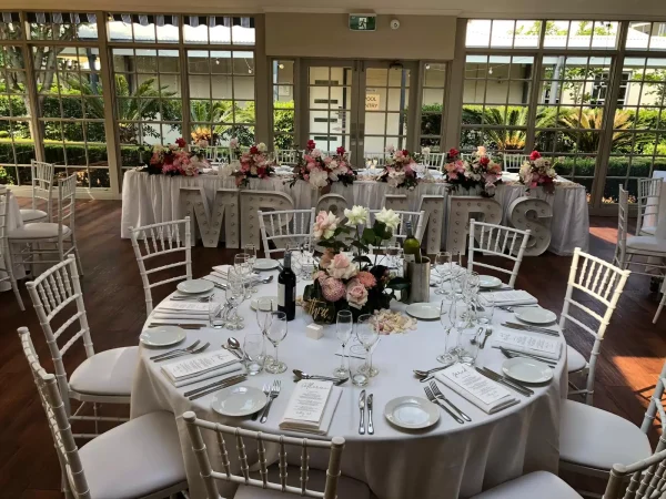 white tiffany chair and banquet table