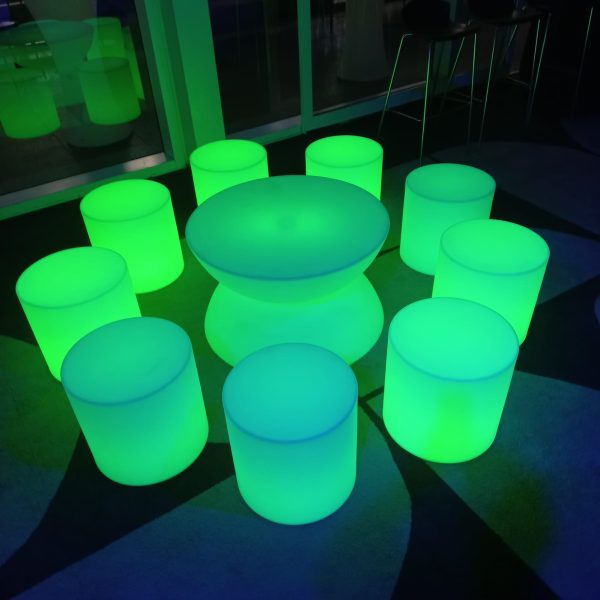 glow coffee table and glow cylinder seats at an evening event