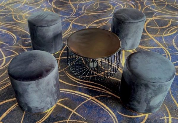 black coffee table and black velvet ottoman stool