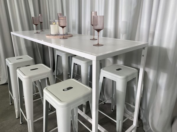 white rectangular tapas table and white tolix stool