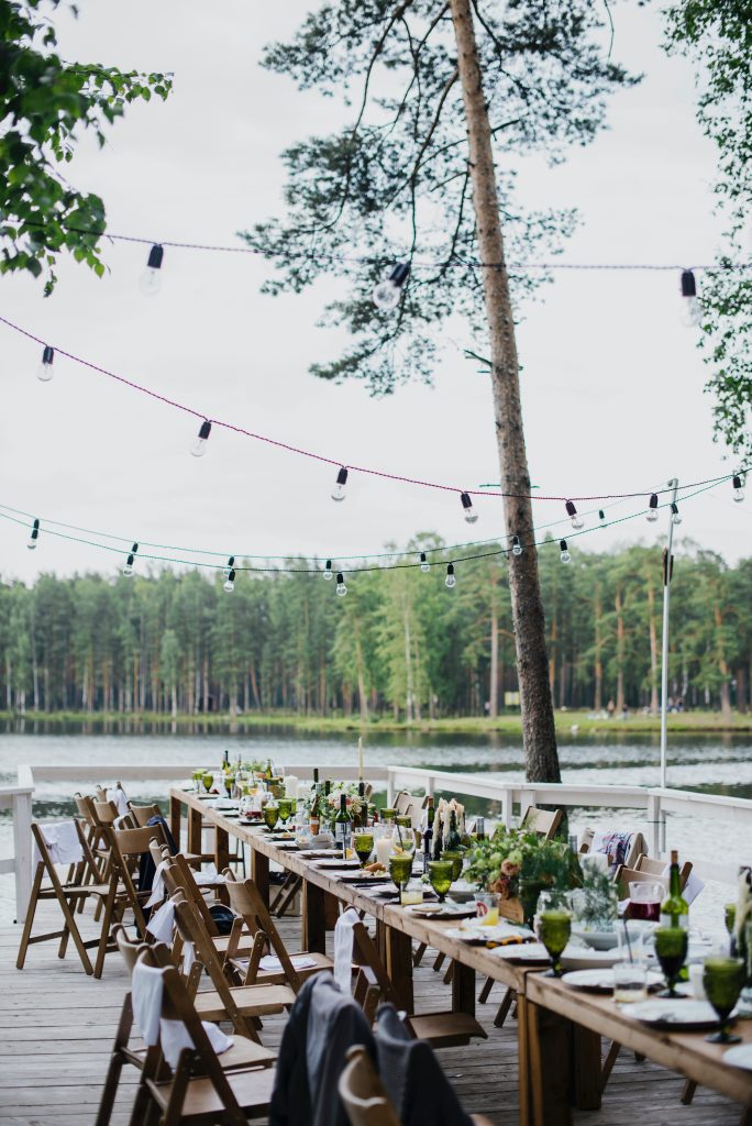 festoon lights hanging above a dinner party