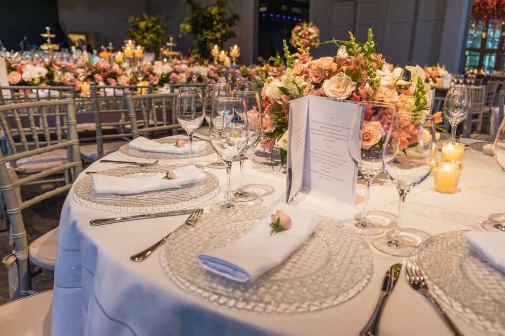 wedding table set up with flowers and glassware